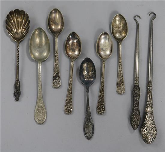 Two silver handled button hooks, a sterling silver teaspoon, a silver preserve spoon and five plated spoons.